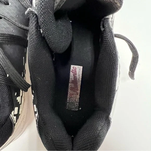 Under armourbaseball tennis shoes black and white size 9 Athletic Shoes